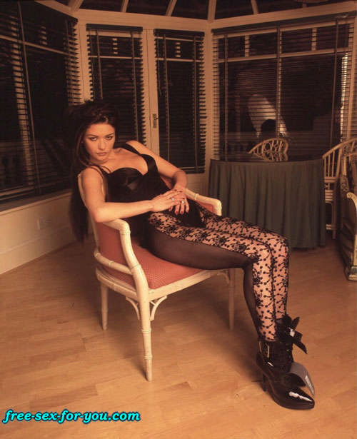 Catherine Zeta Jones in fishnets and posing sexy in mini skirt #75428506