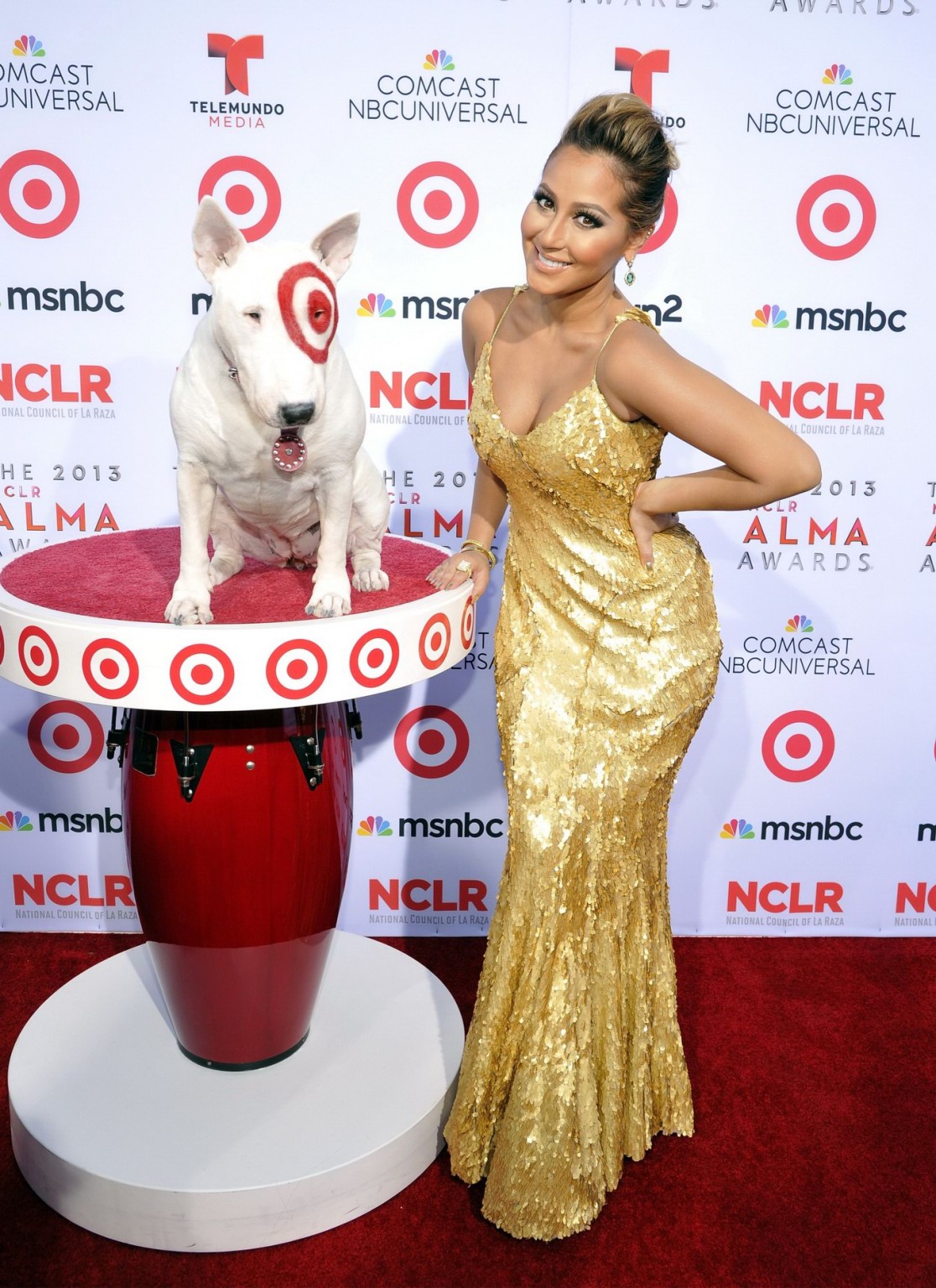 Adrienne Bailon busty wearing low cut golden maxi dress at 2013 NCLR ALMA Awards #75217080