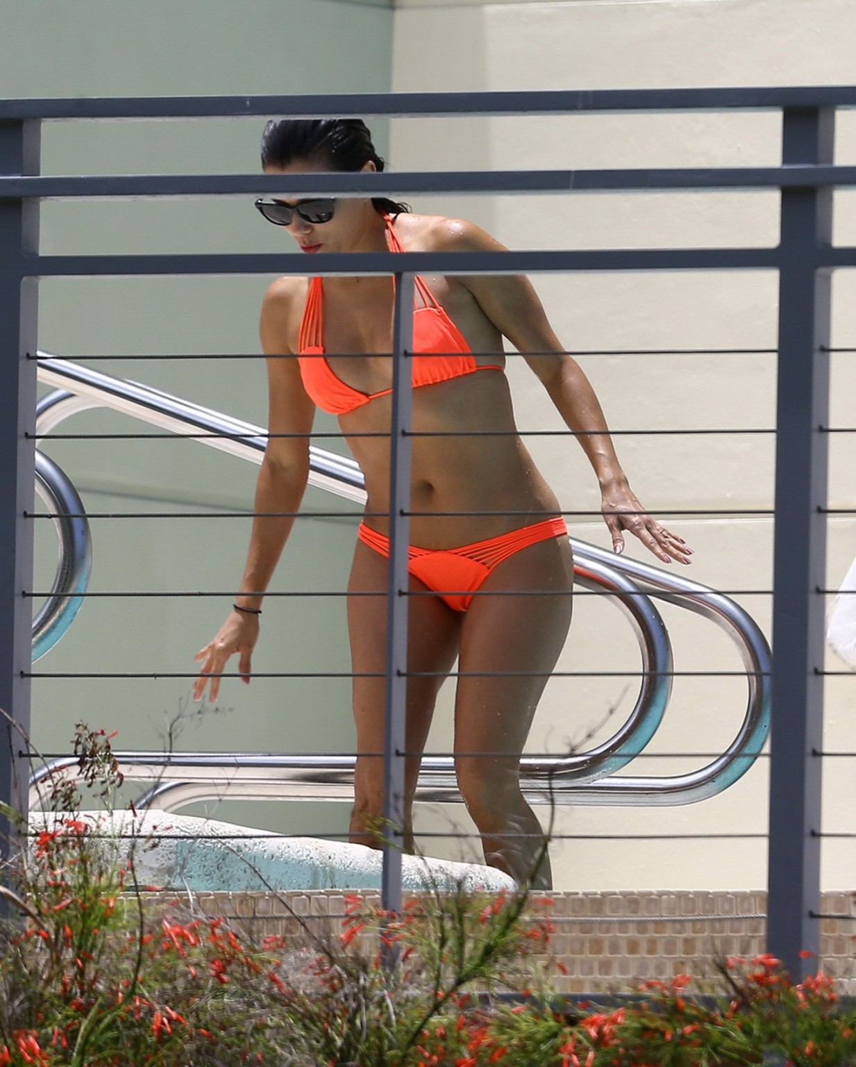 Eva Longoria shows nipple pokies in orange bikini poolside #75160161