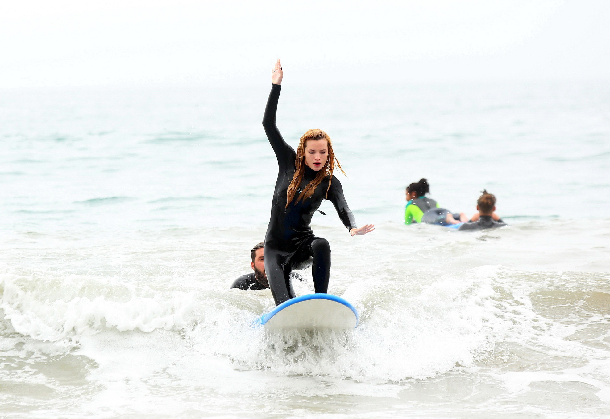 Bella Thorne in bikini and wetsuit surfing at the Surf Camp #75159189