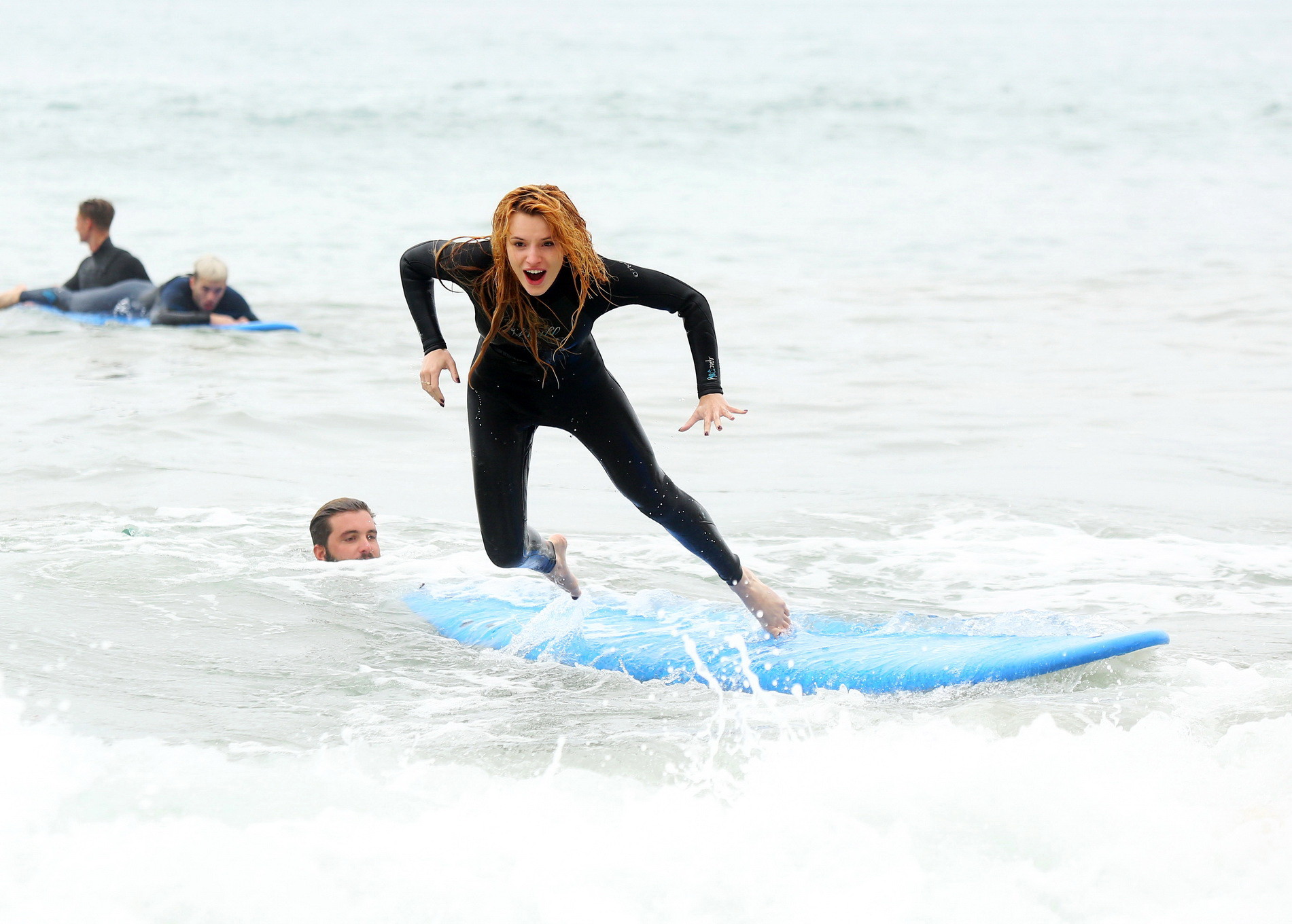 Bella Thorne in bikini and wetsuit surfing at the Surf Camp #75159211