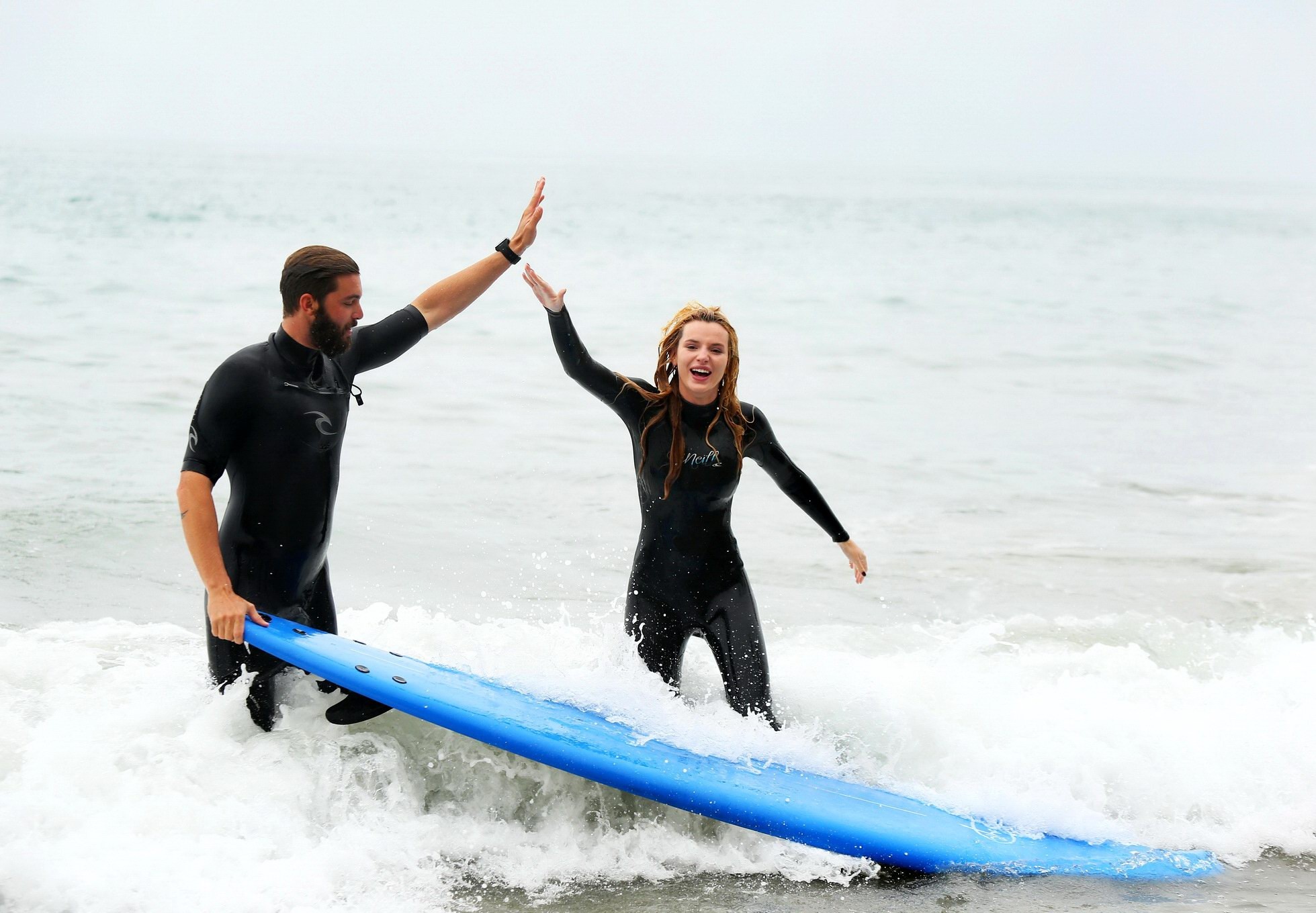 Bella Thorne in bikini and wetsuit surfing at the Surf Camp #75159250