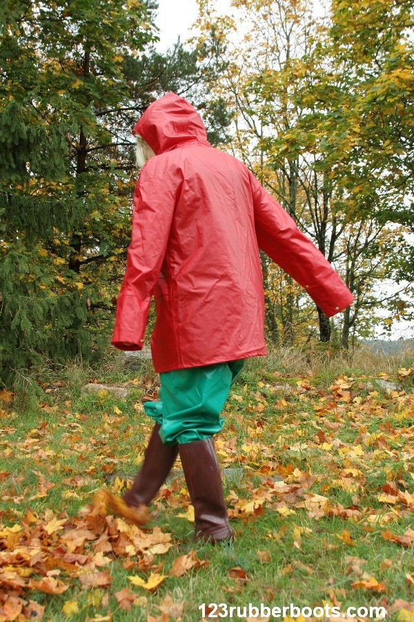 Big boobs girl in rubber rainwear fetish fun outdoors. #73253255