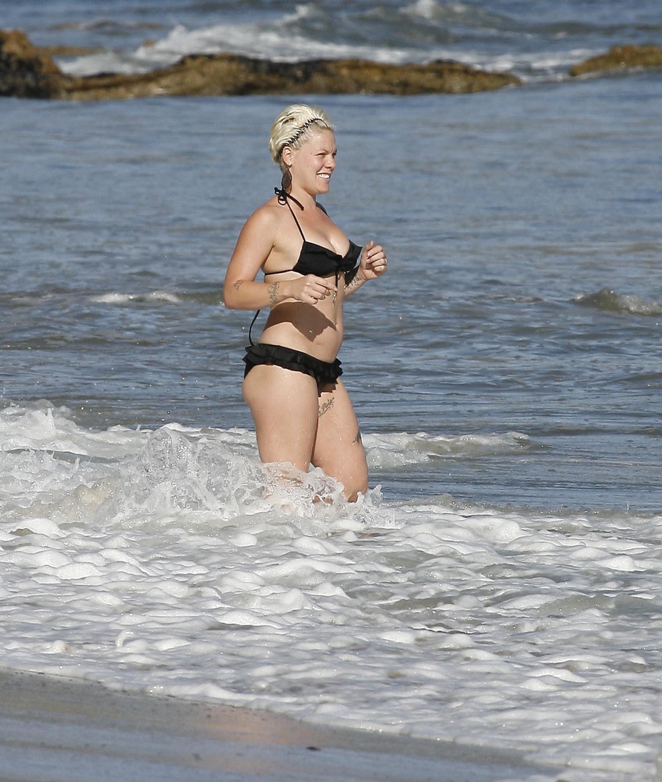 Pink pregnant wearing sexy black bikini on the beach in LA #75326578
