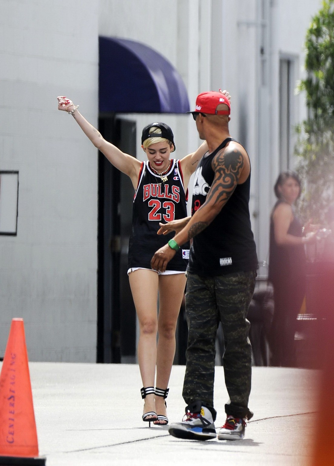 Miley Cyrus leggy wearing a shorts  a jersey outside a studio in LA #75227596