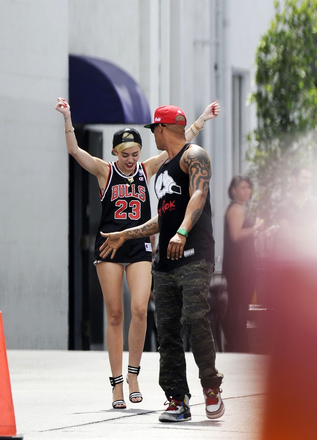 Miley cyrus luciendo piernas con un short y un jersey fuera de un estudio en la
 #75227602