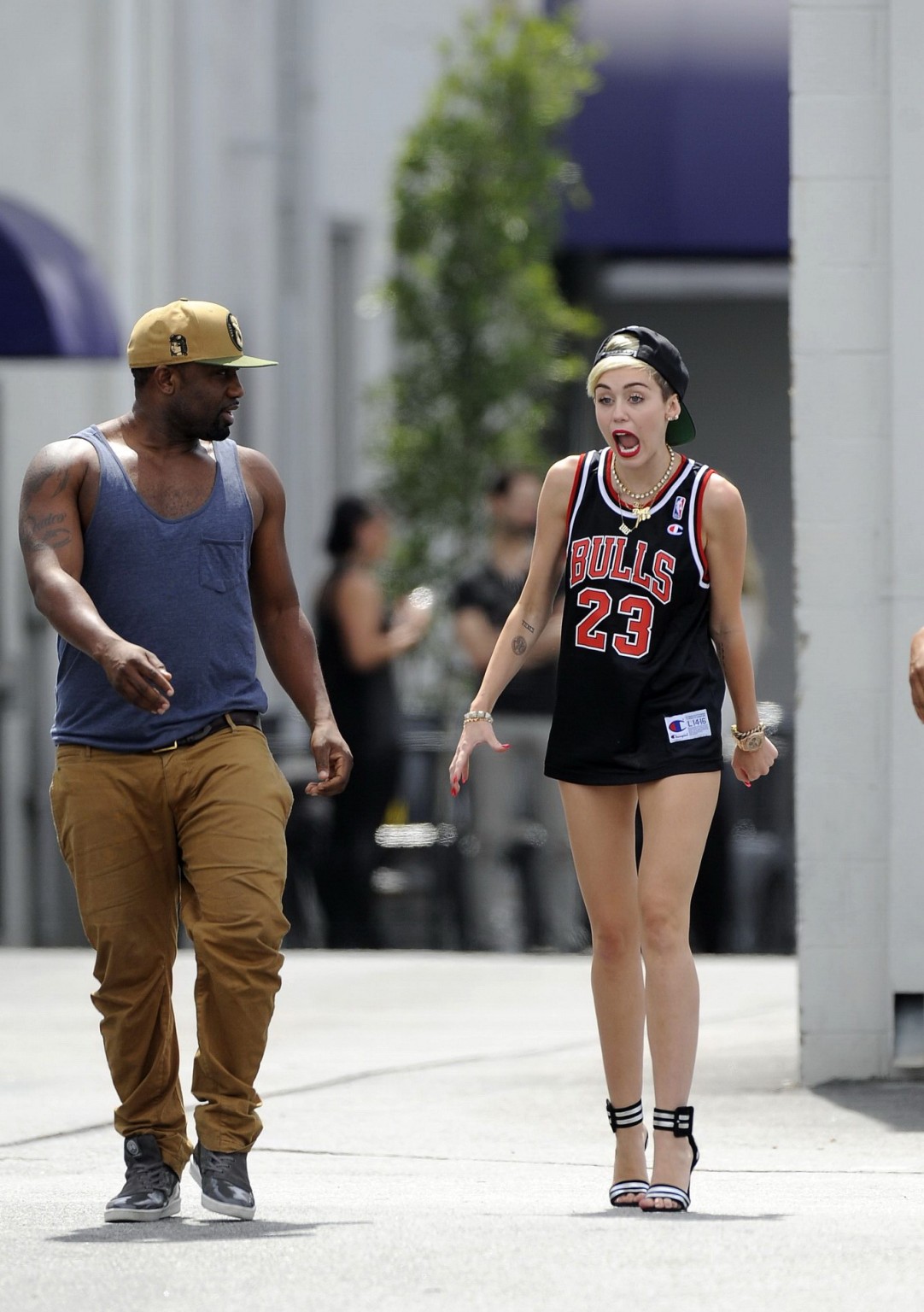 Miley cyrus luciendo piernas con un short y un jersey fuera de un estudio en la
 #75227615