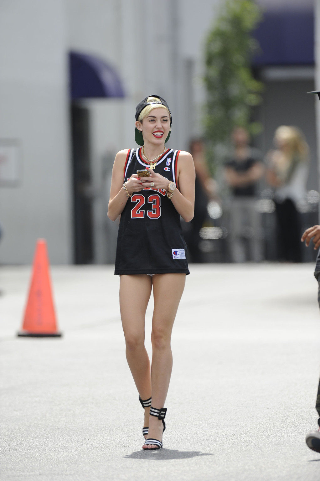 Miley cyrus luciendo piernas con un short y un jersey fuera de un estudio en la
 #75227656