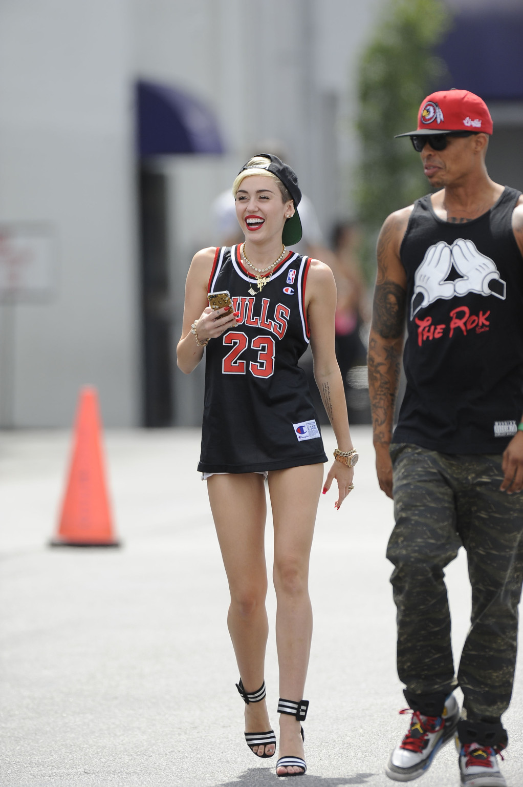 Miley cyrus luciendo piernas con un short y un jersey fuera de un estudio en la
 #75227675