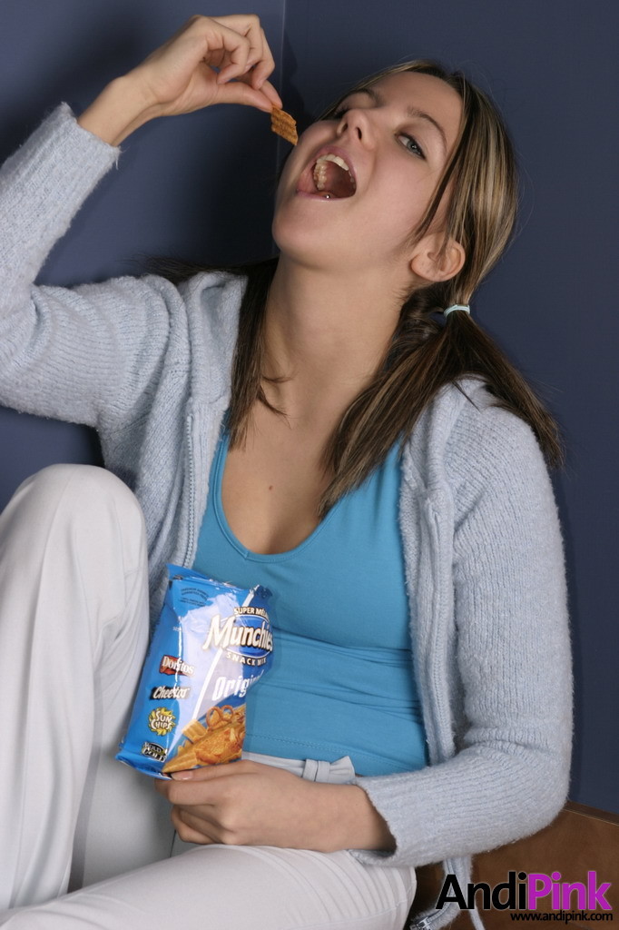 Cute teen girl eats chips #67210155