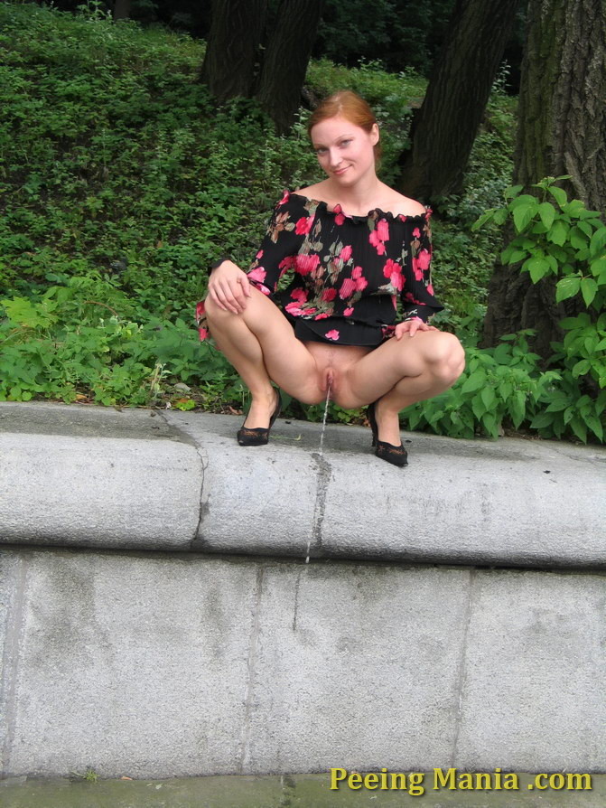 Redhead squats in the park to do a piss as she can not suffer anymore #76568811