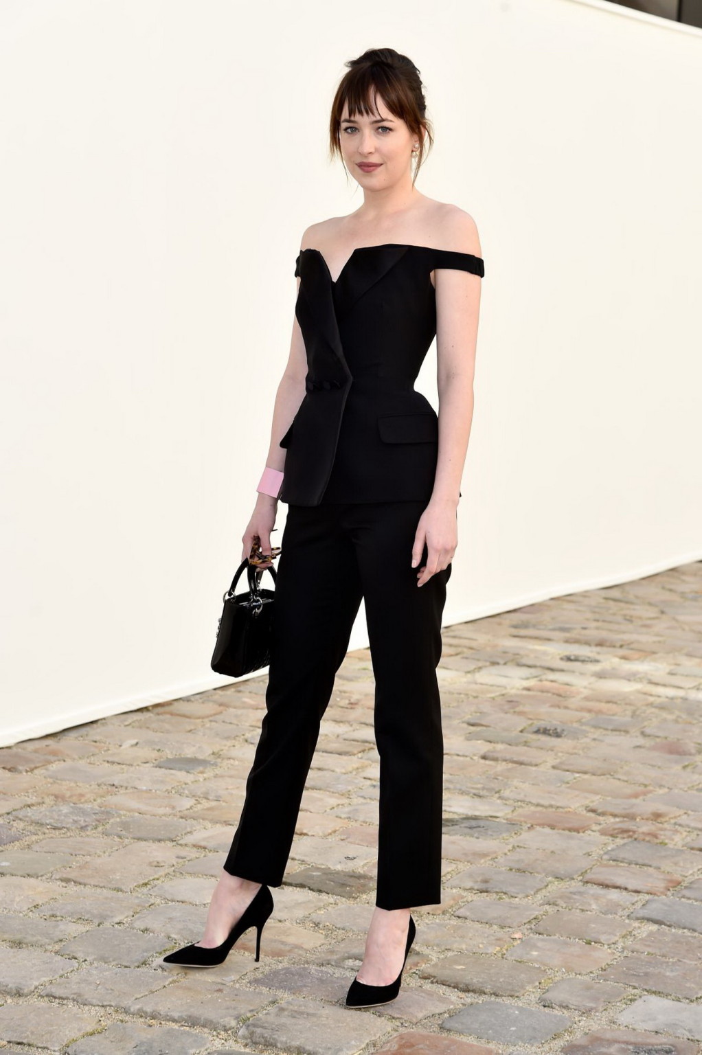 Dakota Johnson showing big cleavage in black jumpsuit at Christian Dior Fashion  #75171098