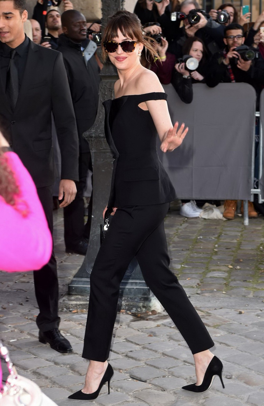 Dakota Johnson showing big cleavage in black jumpsuit at Christian Dior Fashion  #75171138