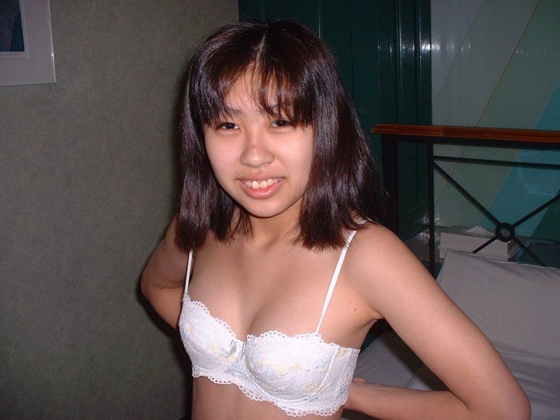 Asian teenie posing naked and showing off her pussy #69858659