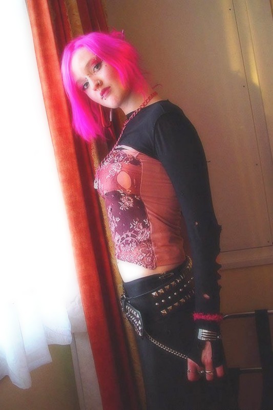 Pink haired gothic fetish chick showing off  her pierced boobs #73272694