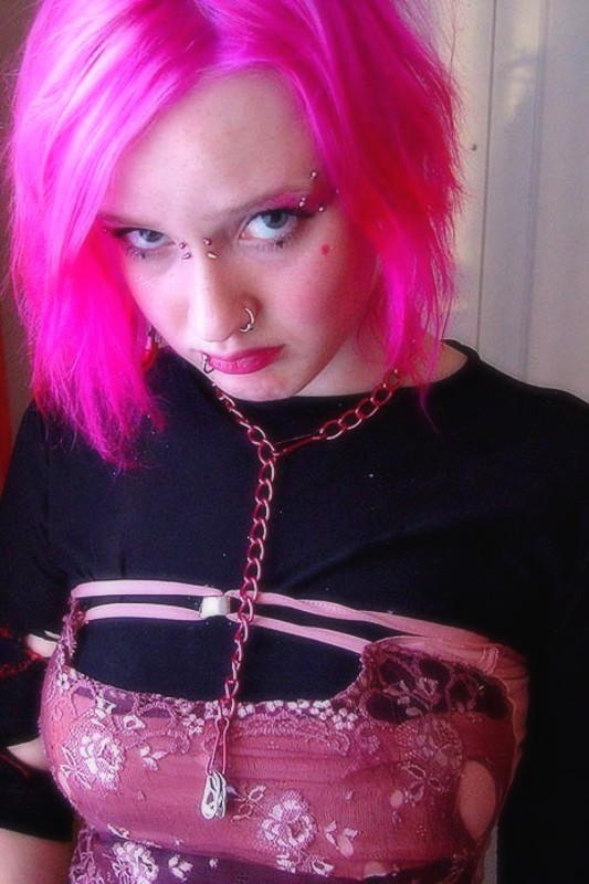 Pink haired gothic fetish chick showing off  her pierced boobs #73272702