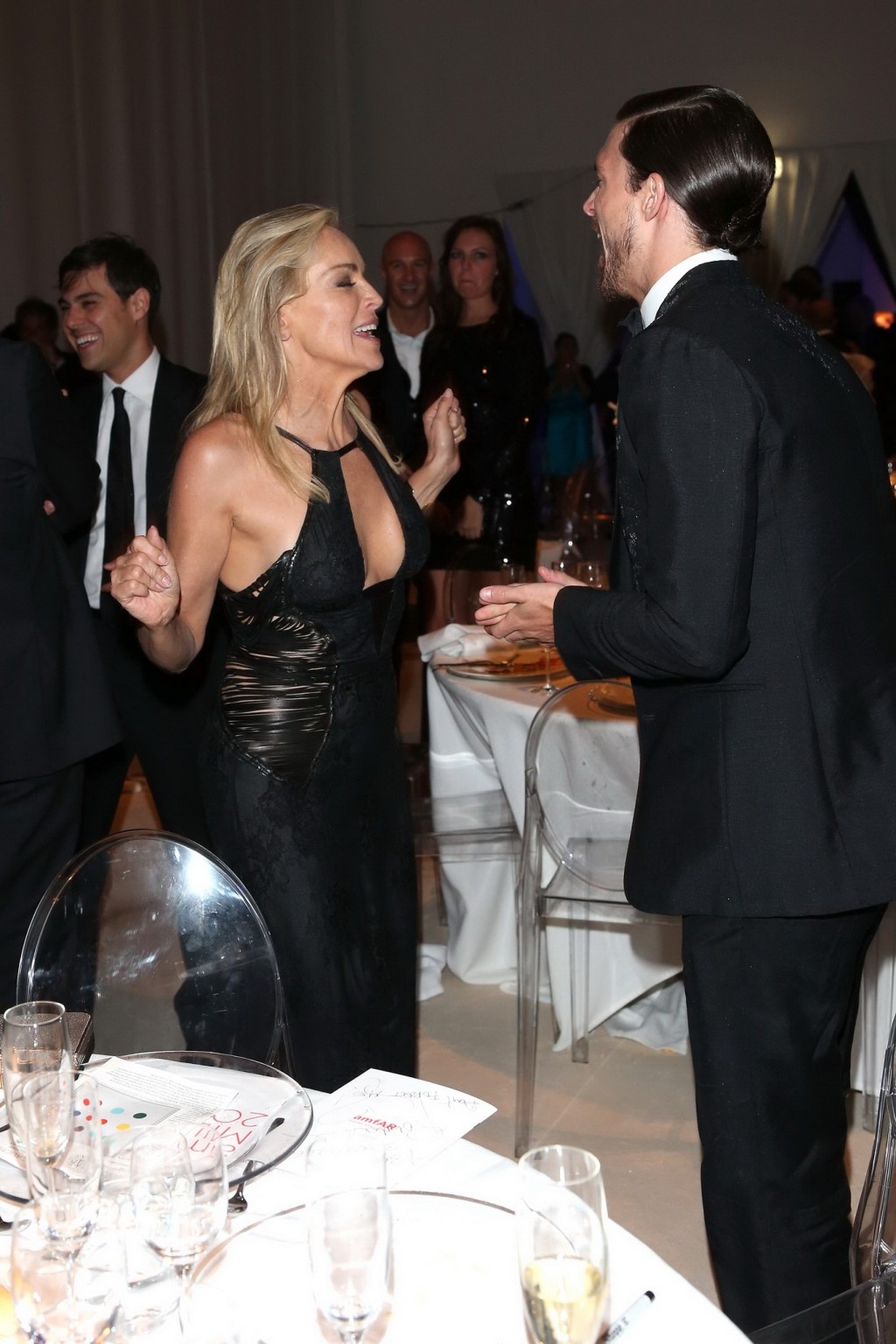 Sharon Stone showing cleavage at amfAR event during Milan Fashion Week #75251886