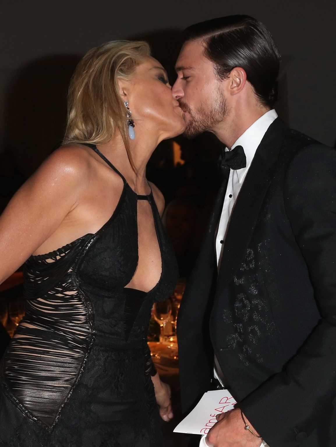 Sharon Stone showing cleavage at amfAR event during Milan Fashion Week #75251898