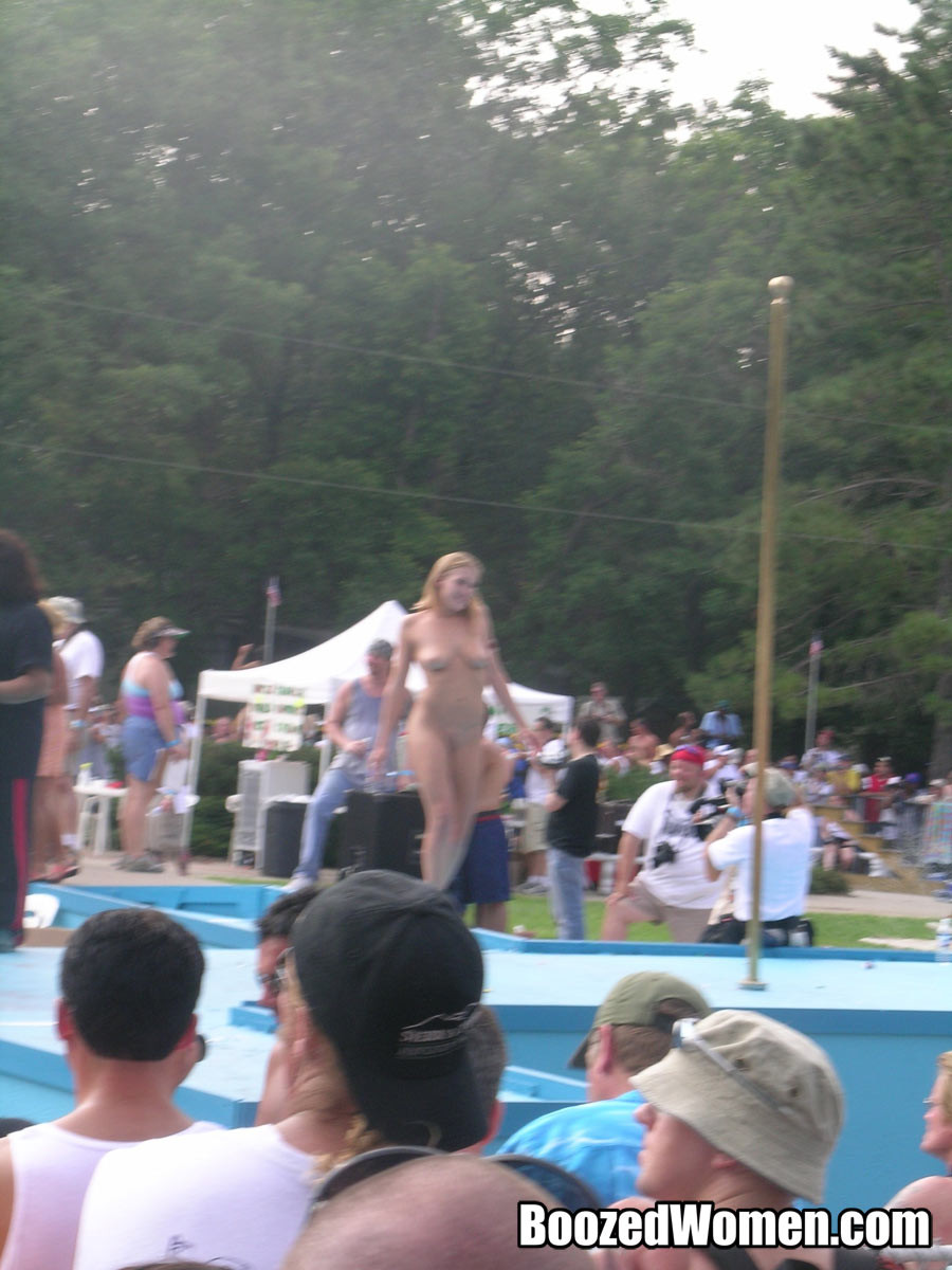 naked strippers bent over at an outdoor event #78912591