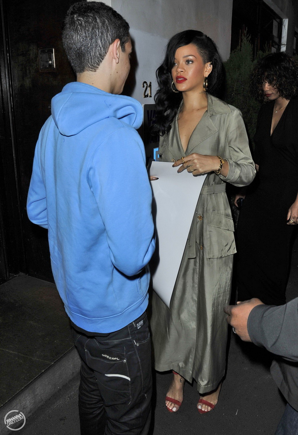 Rihanna showing big cleavage  long legs in wide open topcoat out in Sydney and a #75266853