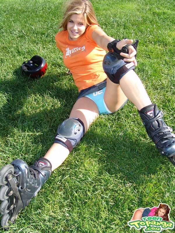 Adorable eighteen year old rollerblading and flashing outdoors #78608764