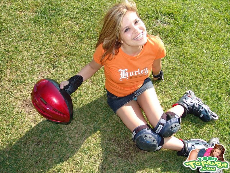 Adorable eighteen year old rollerblading and flashing outdoors #78608809