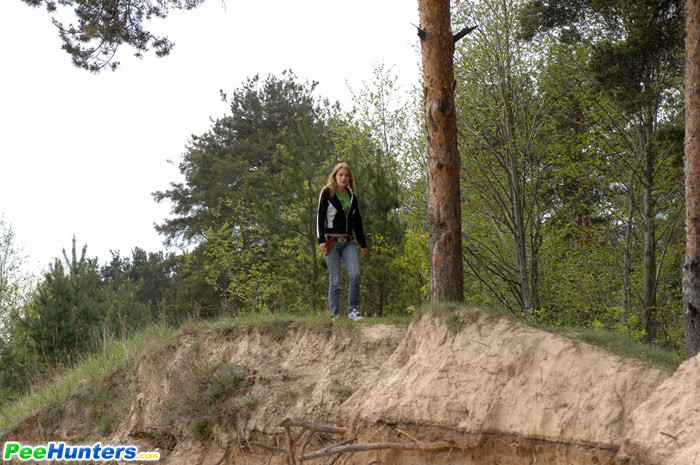 Beautiful teen plays watersports on a quiet forest glade #78692829