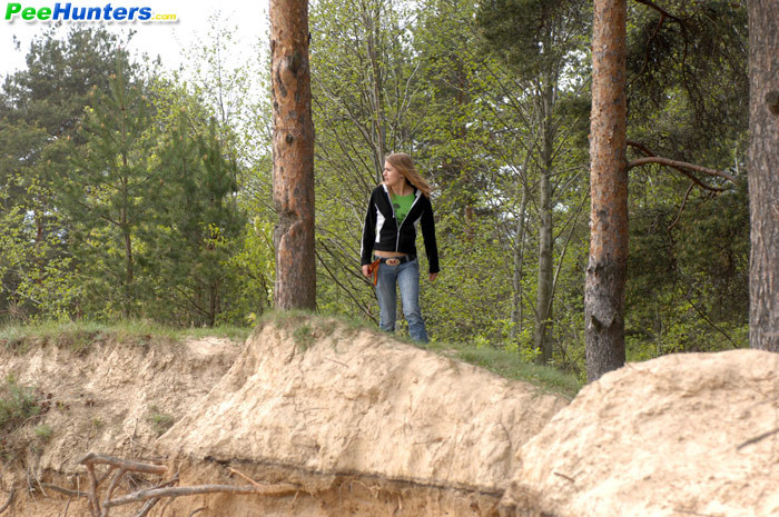 Beautiful teen plays watersports on a quiet forest glade #78692835