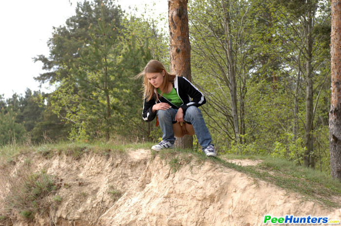 Beautiful teen plays watersports on a quiet forest glade #78692866