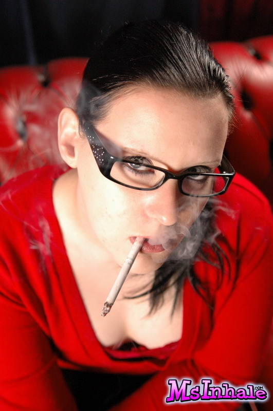Cute teen in glasses smokes a menthol cigarette #74860239