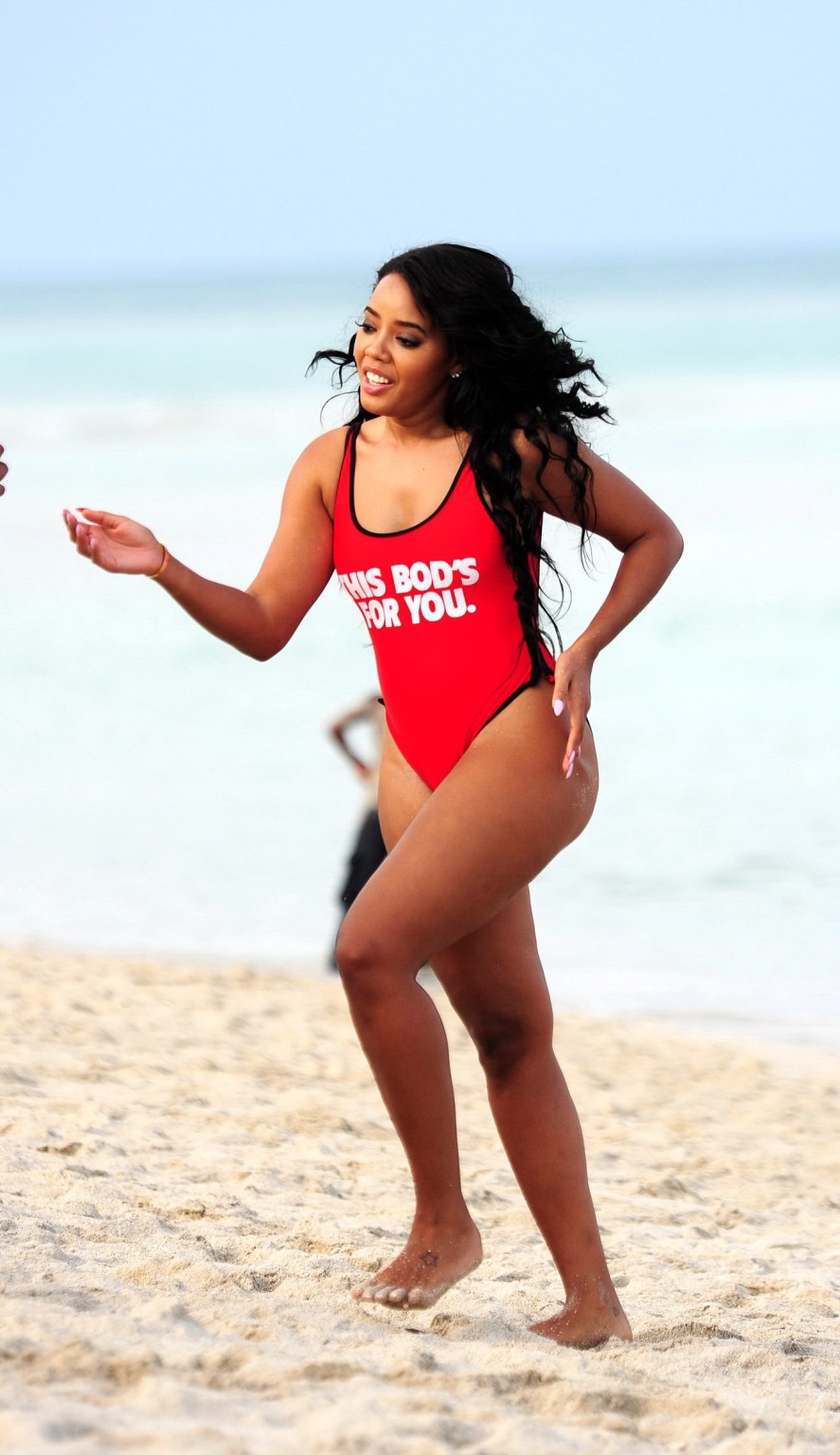 Angela Simmons in red swimsuit doing a bridge on a beach in Miami #75168078