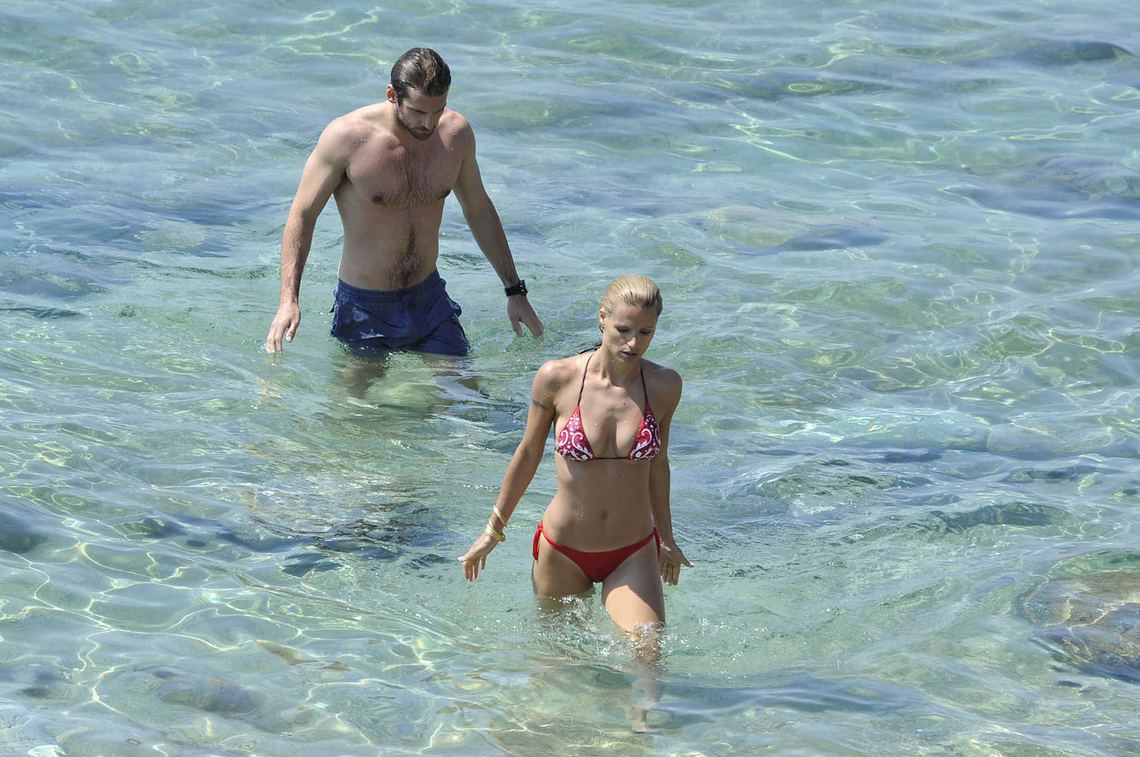 Michelle Hunziker busty wearing a skimpy bikini on the beach in Miami #75259531