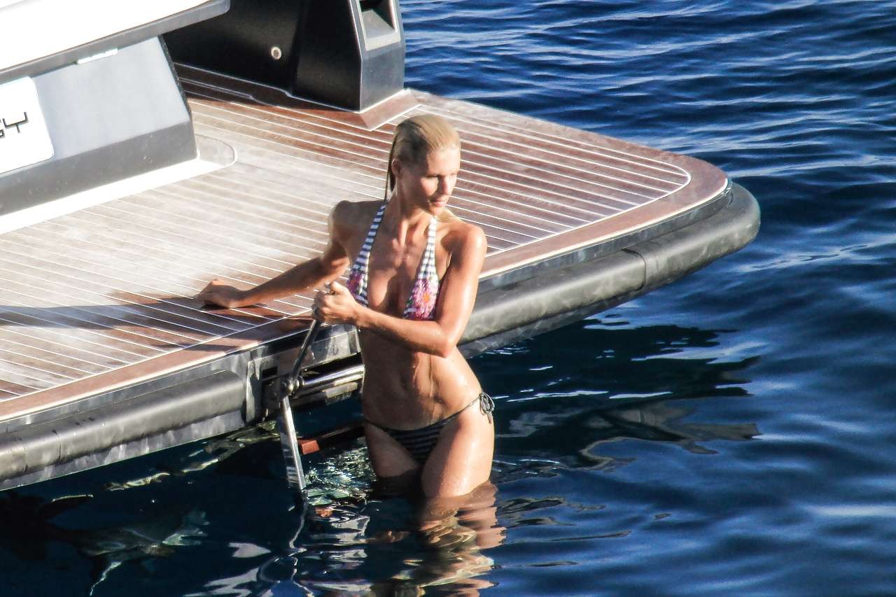 Michelle Hunziker showing her great ass in bikini thong paparazzi pictures #75252424