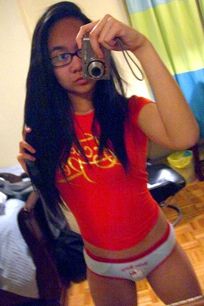 Cute Asian teen with glasses taking selfpics #68461152