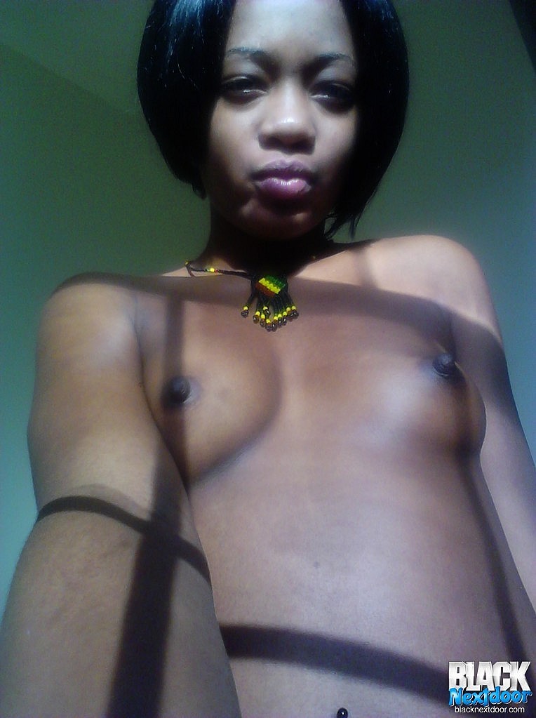 Black teen with small tits posing in the sun lights