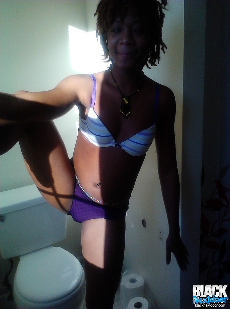 Black teen with small tits posing in the sun lights #67188423