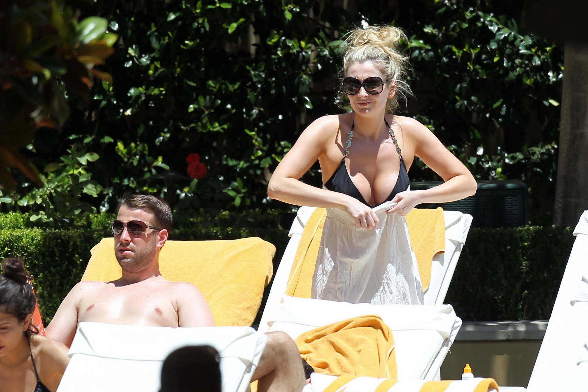 Gemma Merna showing off her curvy body wearing skimpy black bikini at the pool i