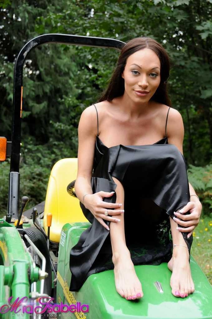 Sexy shemale posing on a tractor #79233184