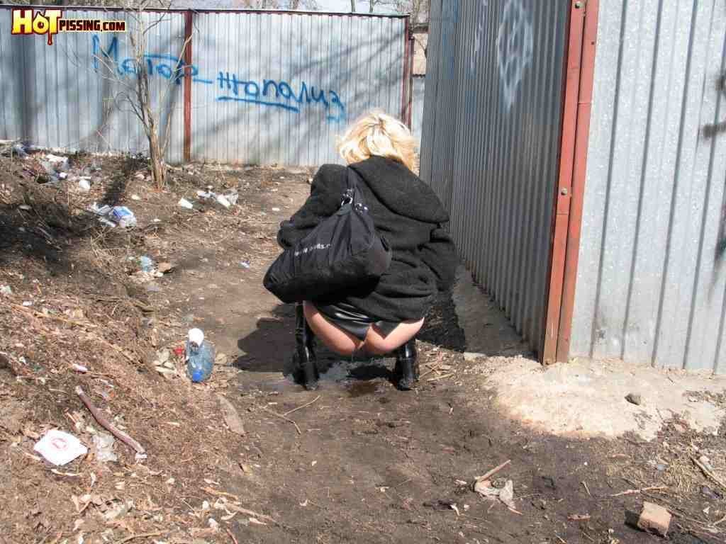 Blonde pissing outside #76592973