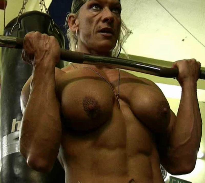 female bodybuilder showing off her muscles #76491890
