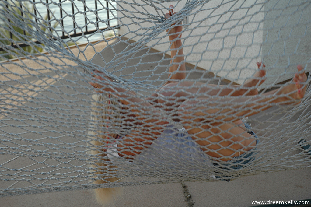 Blonde teen playing on a hammock #74043373