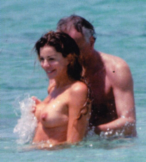 Alba Parietti showing her big tits and ass on beach to paparazzi #75418651