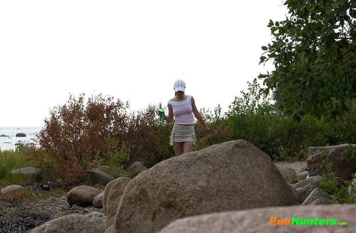 Hot teen smoker piddling off the rock in the park #78691073