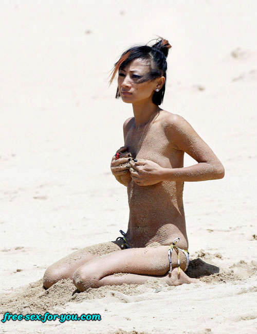 Bai Ling showing her pussy and small tits to paparazzi on beach #75419450