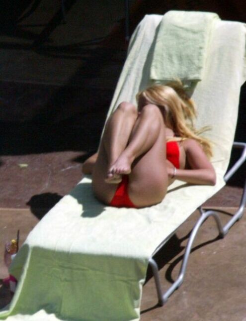 sexy pop star Britney Spears stretching in a red thong bikini #75368785