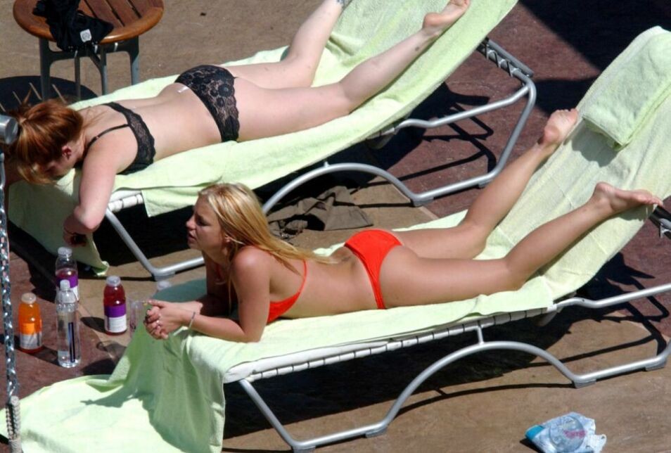 sexy pop star Britney Spears stretching in a red thong bikini #75368810