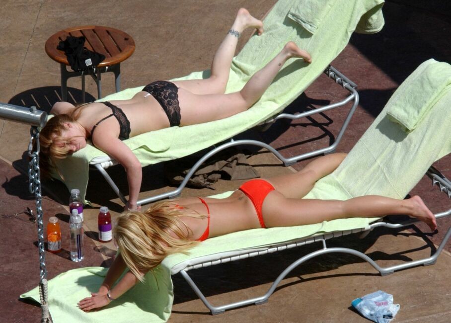 sexy pop star Britney Spears stretching in a red thong bikini #75368825