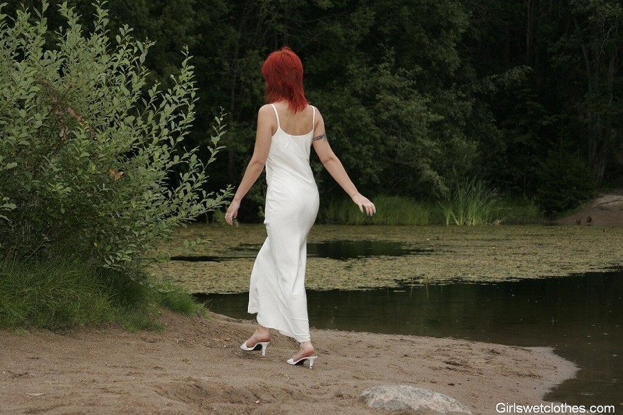 Sexy redhead in a wet evening dress #76650367
