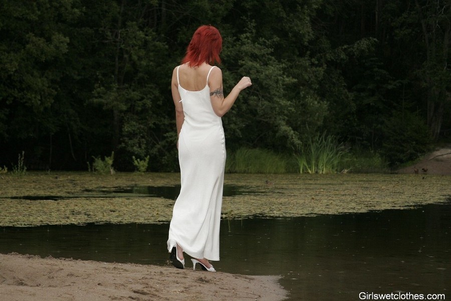 Sexy redhead in a wet evening dress #76650393