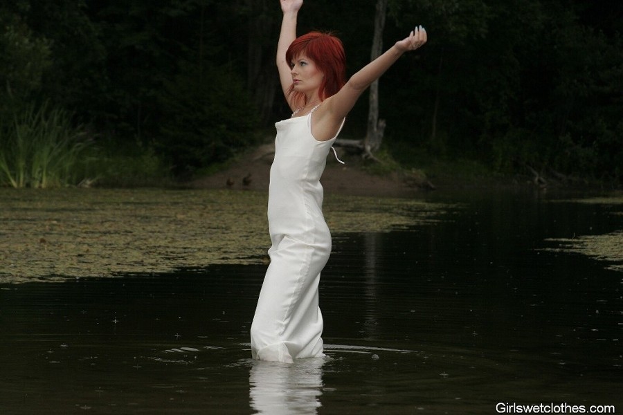 Sexy redhead in a wet evening dress #76650426